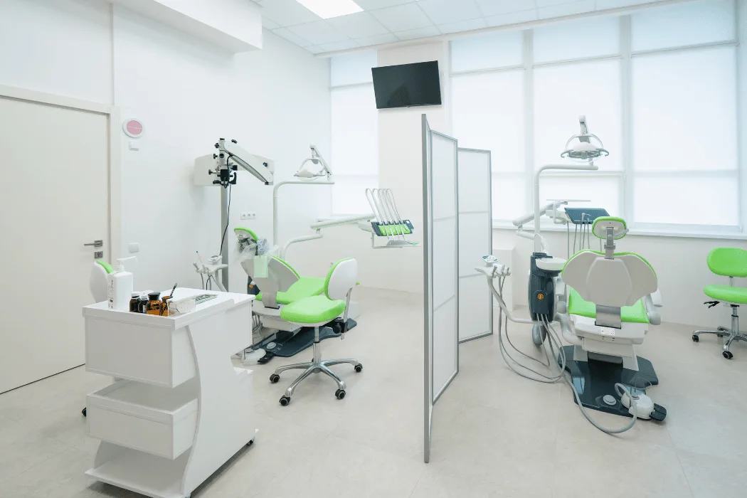 A treatment room with two dental chairs