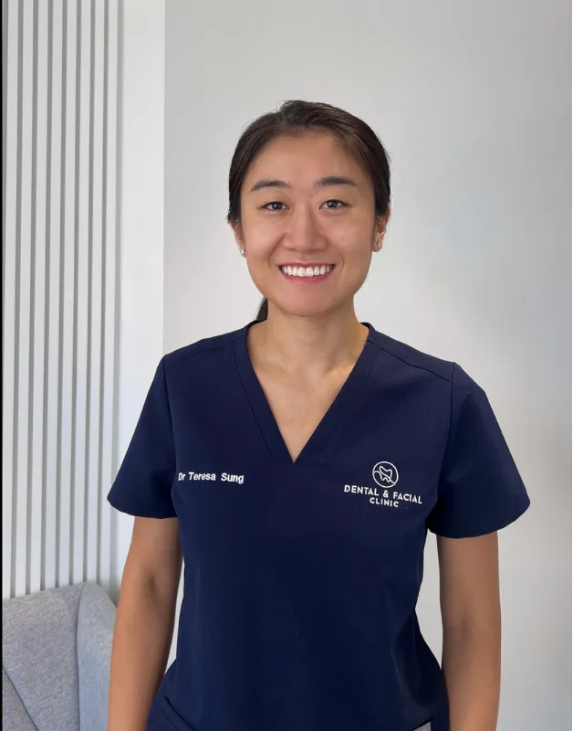 Dr Teresa Sung, Principal Dentist, in navy scrubs at the clinic